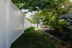 View of fenced backyard