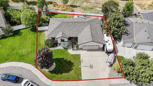 Aerial view of property and surrounding area featuring property parcel outlined