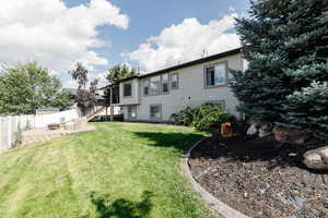 View of yard featuring a patio, stairs, and a fire pit