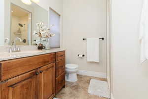 Primary Bathroom with vanity, a stall shower, and light tile patterned floors