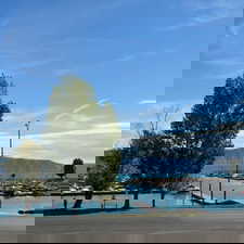 Water view featuring a dock and a mountainous background