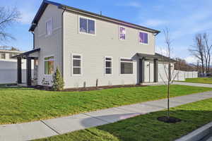View of front facade featuring concrete driveway