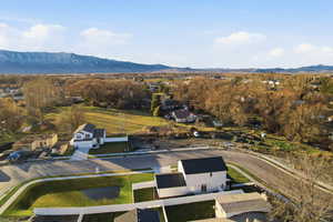Aerial perspective of suburban area featuring a mountain backdrop