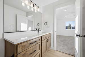 Bathroom with vanity and light wood-style flooring