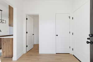 Entrance foyer featuring light wood-style flooring and a chandelier