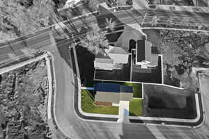 Aerial view of property and surrounding area with property parcel outlined