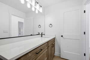 Bathroom featuring vanity and light wood-style flooring