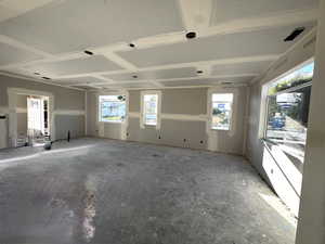 Empty room featuring plenty of natural light