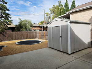 View of shed featuring a fenced backyard