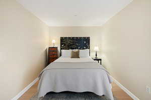 Bedroom with light wood-style floors