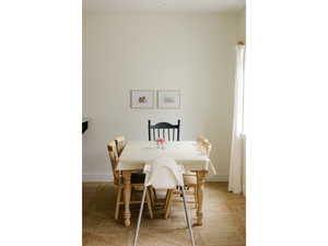 Dining space with light wood finished floors and baseboards