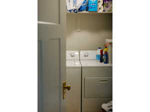 Washroom featuring washer and dryer