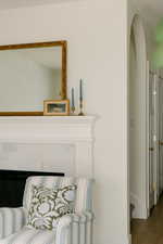 Sitting room with wood finished floors and baseboards