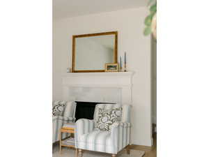 Living area featuring baseboards and wood finished floors