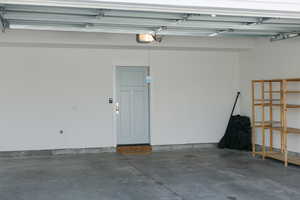 Garage featuring a garage door opener