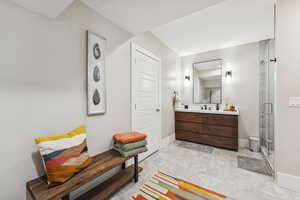 Full bath with vanity and a stall shower