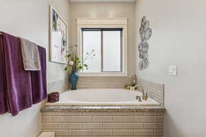 Full bath featuring a bath