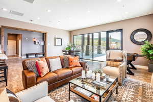 Living area featuring recessed lighting and light wood finished floors