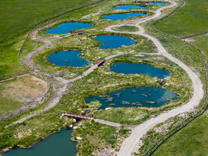 Aerial view of property's location featuring a nearby body of water