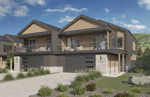 View of front of house with a balcony, concrete driveway, and a garage