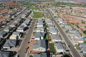 Aerial view of property's location featuring nearby suburban area