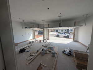 Garage featuring baseboards
