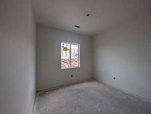Unfurnished room featuring baseboards