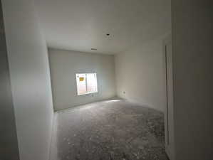 Empty room with a textured ceiling
