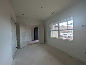 Spare room with arched walkways