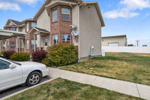 View of side of property with brick siding and stucco siding