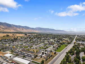 Aerial view of residential area featuring a mountain backdrop