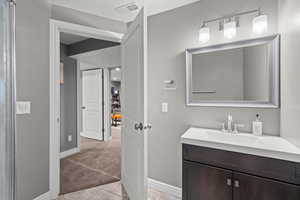 Bathroom featuring vanity and light tile patterned flooring