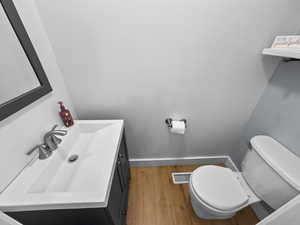 Bathroom with vanity and light wood finished floors