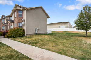 View of home's exterior featuring brick siding