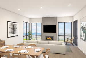 Living room featuring recessed lighting, light wood finished floors, and a large fireplace