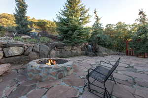 View of patio / terrace with a fire pit