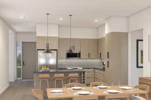Kitchen with pendant lighting, stainless steel appliances, modern cabinets, a kitchen breakfast bar, and backsplash