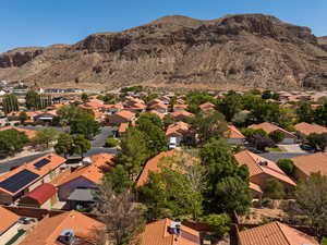 Aerial view of residential area featuring mountains