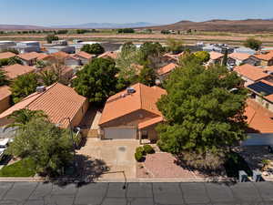 Aerial perspective of suburban area with a mountain backdrop