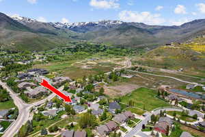 View of property location with a mountainous background and nearby suburban area
