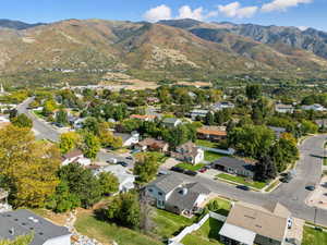 View of property location with mountains and nearby suburban area