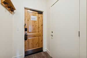 Doorway with wood finished floors