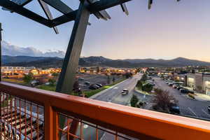 Balcony at dusk with a mountain view