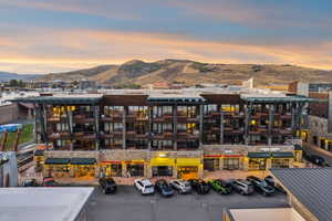 View of apartment building / complex featuring a mountain view