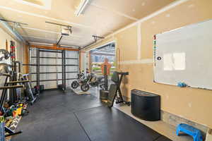 Workout area featuring a garage