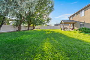 Fenced backyard with a patio area