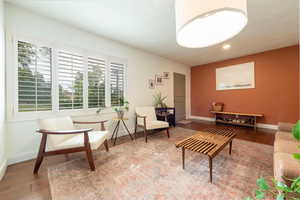 Living room featuring baseboards and dark wood finished floors