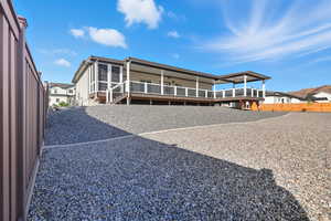 Back of house with a wooden deck
