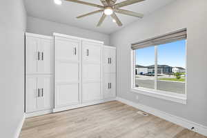 Unfurnished bedroom with light wood-style floors, a ceiling fan, and recessed lighting