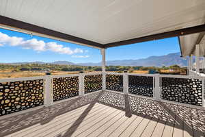 Wooden deck featuring a mountain view